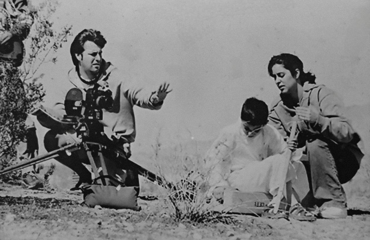 John Treviño directing a scene outdoors with cast and crew
